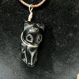 Black stone carved Kitty with hand made harness.